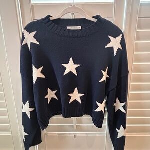 Navy blue, cropped sweater with white stars